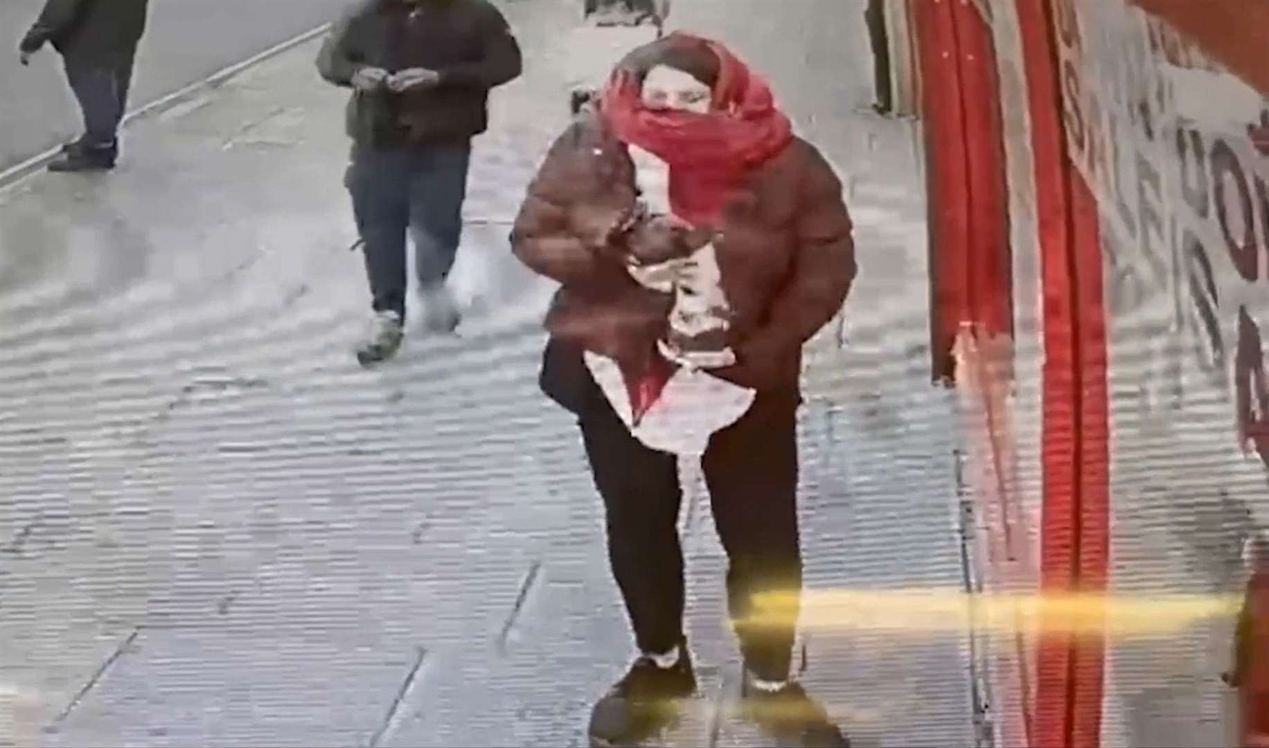 CCTV footage of Constance Marten holding baby Victoria under her coat outside Special Connection in East Ham, London (Metropolitan Police/PA)