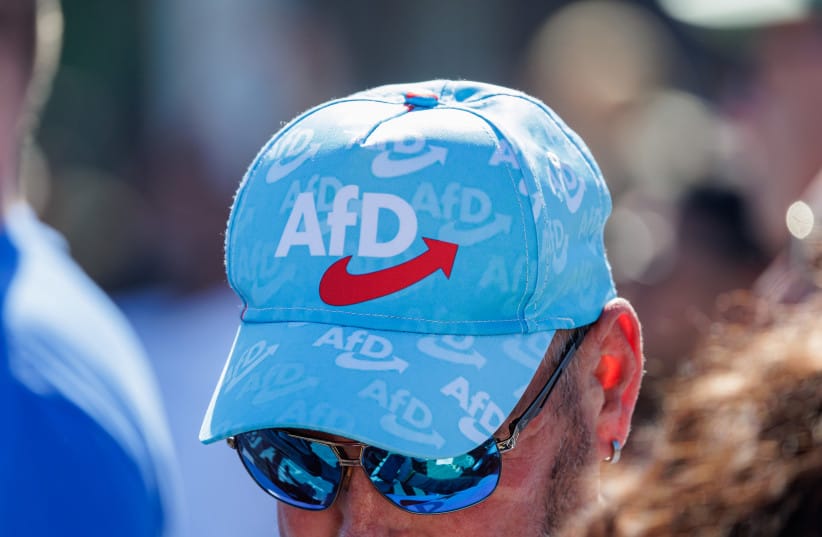 An AfD supporter takes part at a May Day AfD family fest on May 1, 2026 in Schonebeck, Germany.