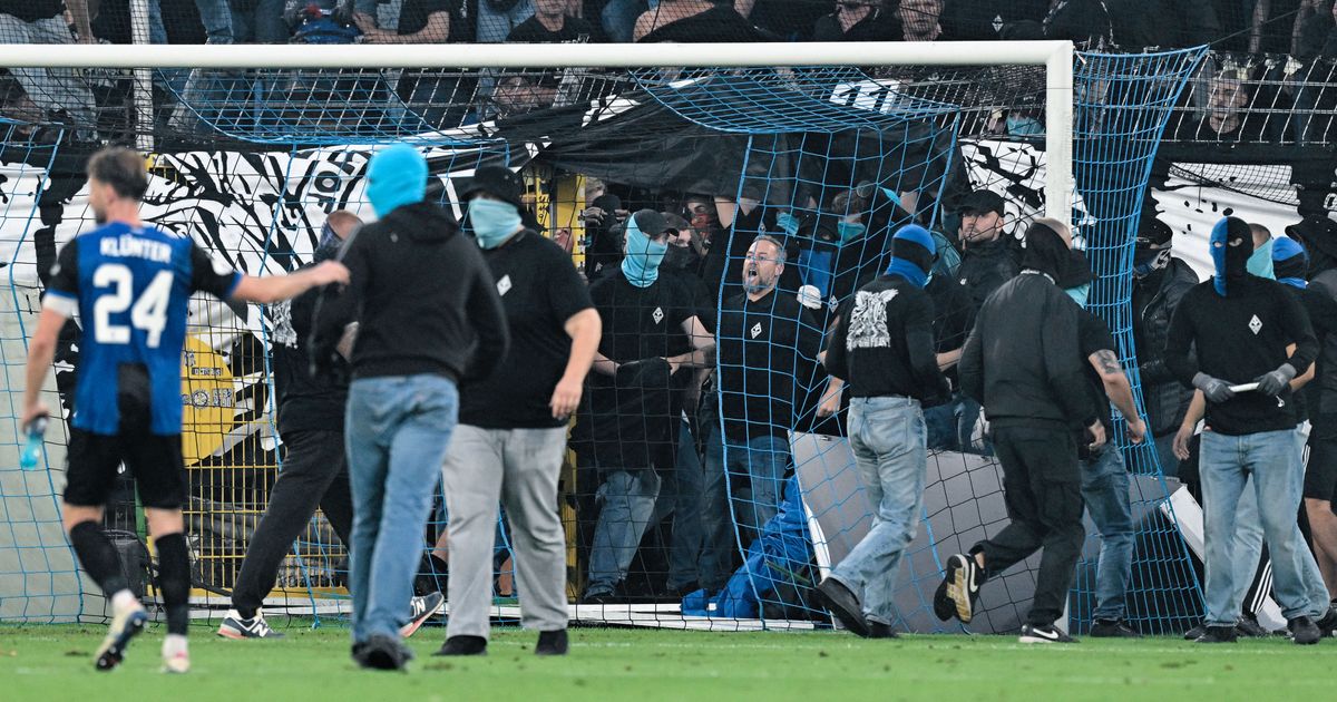 German Cup match marred by fireworks, pitch invasion :: WRAL.com