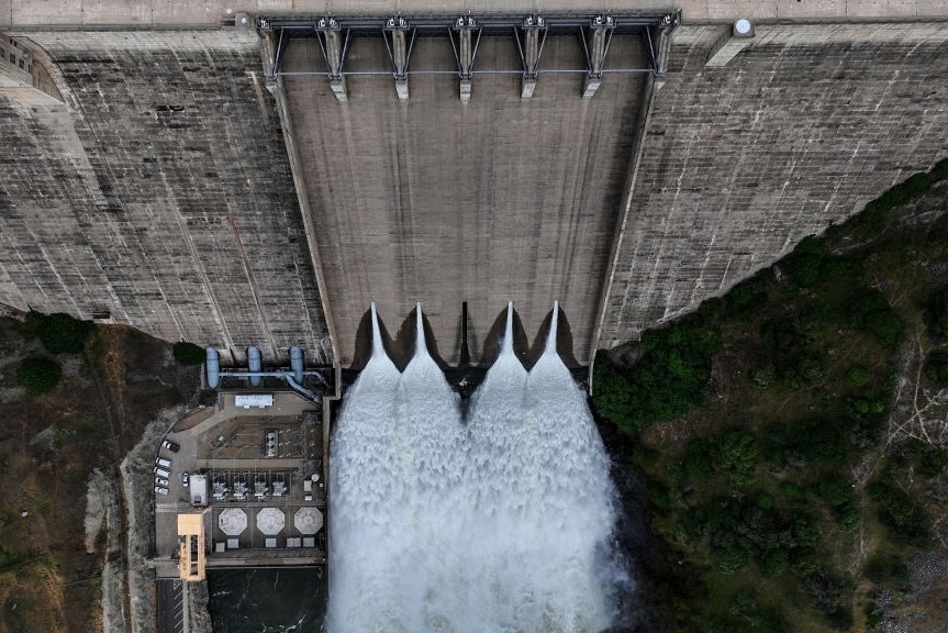 Water rushes out of Pine Flat Dam.