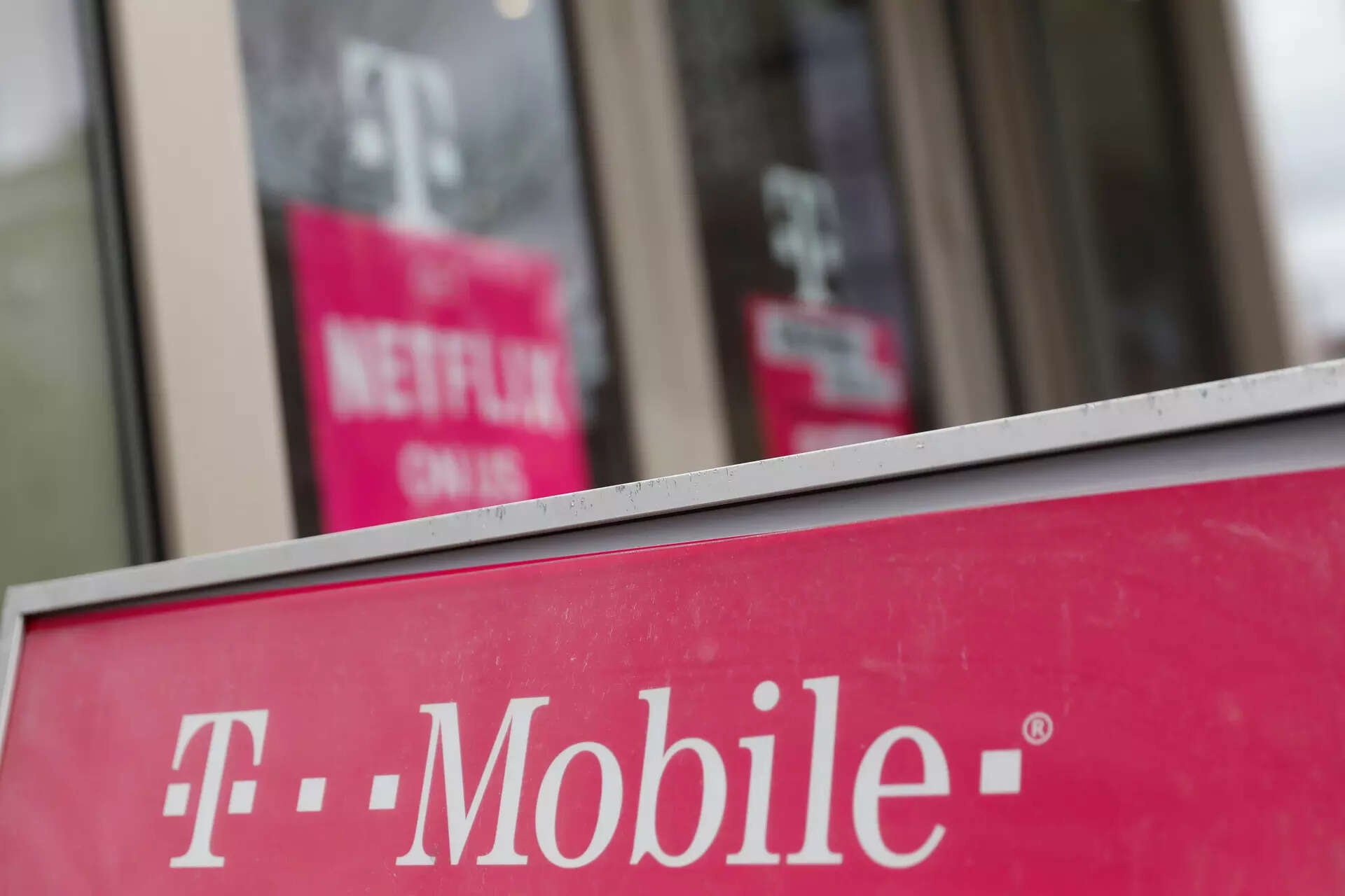 A sign for a T-Mobile store is seen in Manhattan, New York, U.S., April 30, 2018. REUTERS/Shannon Stapleton/File Photo