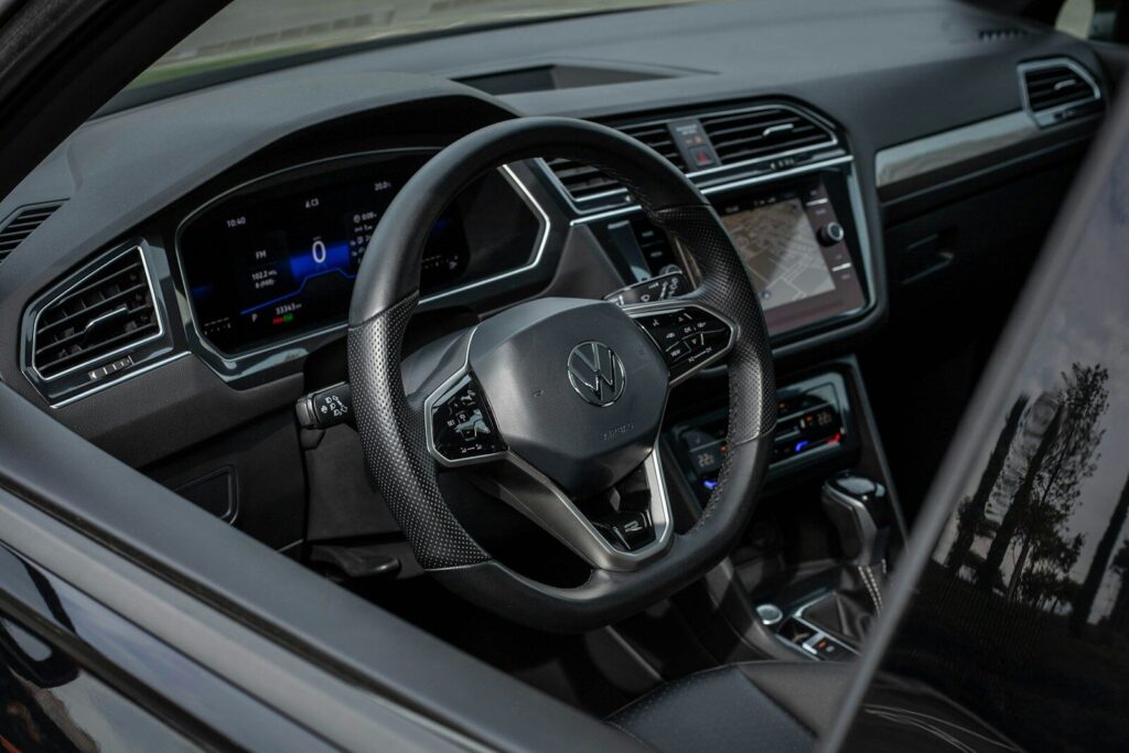 Modern car interior with digital dashboard and steering wheel