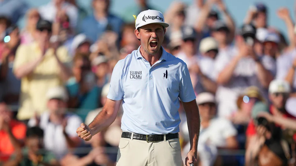 JT Poston celebrates holing the winning putt at the 2026 Memorial Tournament
