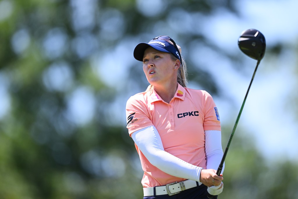 Brooke M. Henderson of Canada teeing off on the 13th hole during the third round of The Amundi Evian Championship 2026.