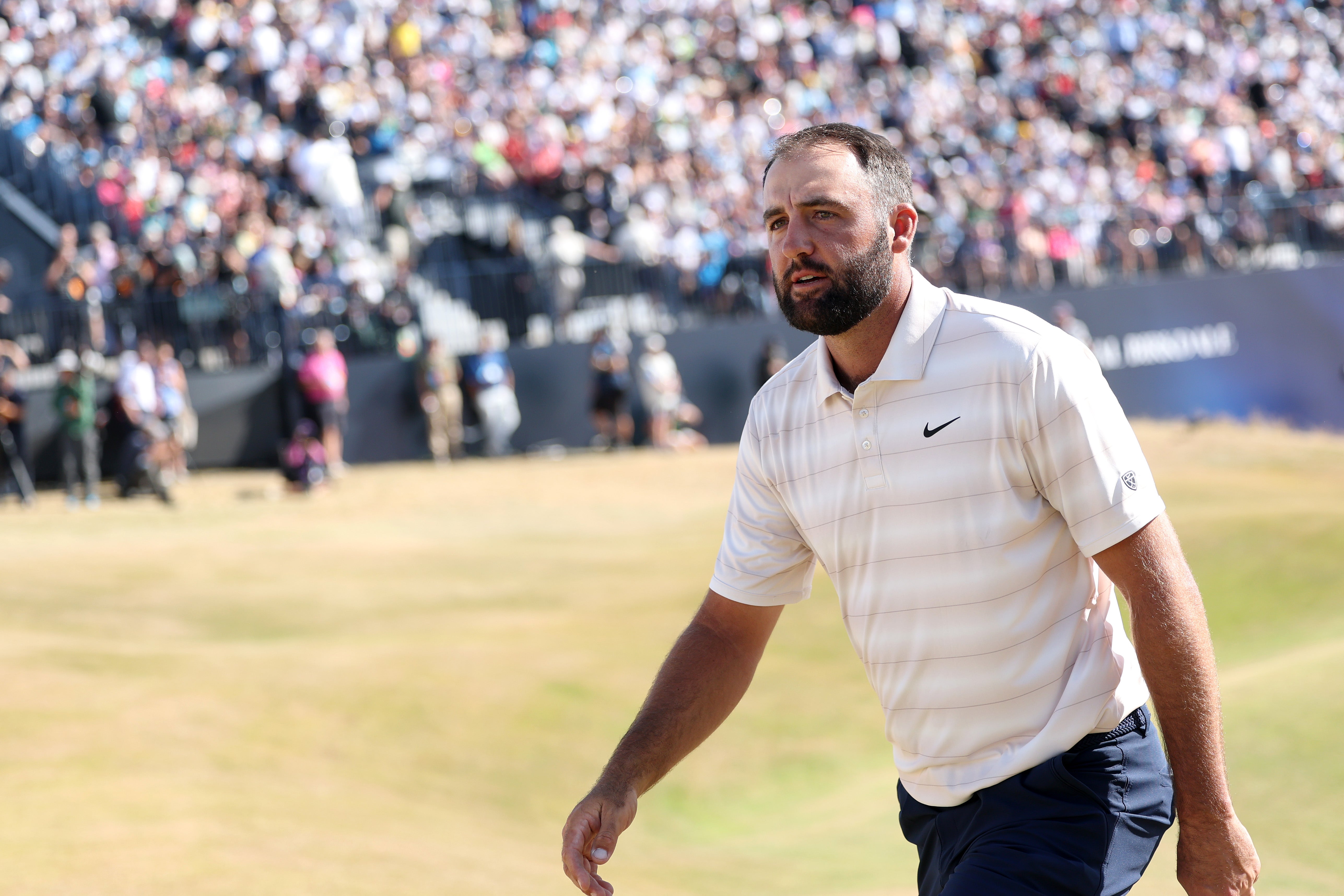 Scottie Scheffler of the United States walks on the 18th green