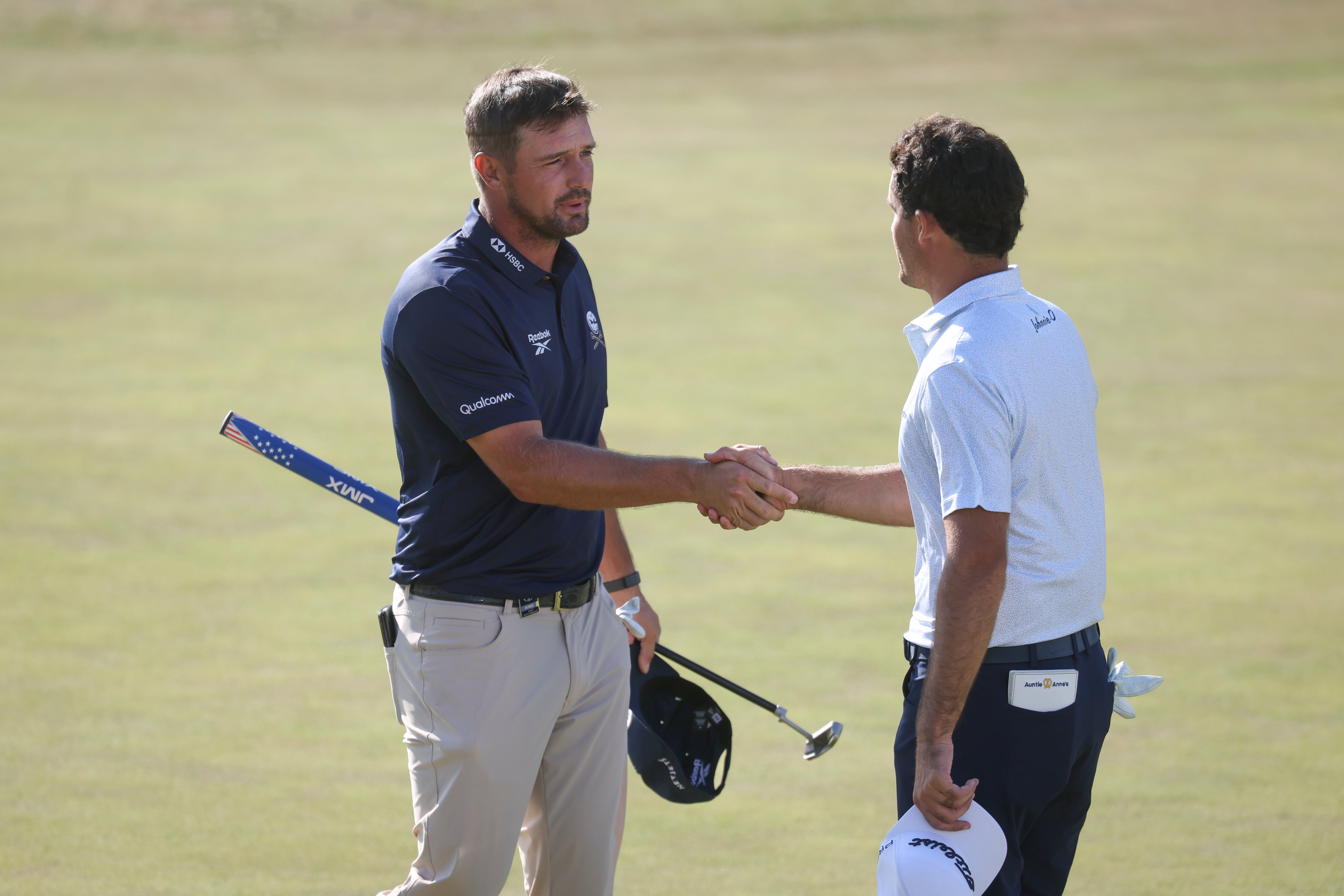 Bryson DeChambeau shakes hands with Jackson Suber