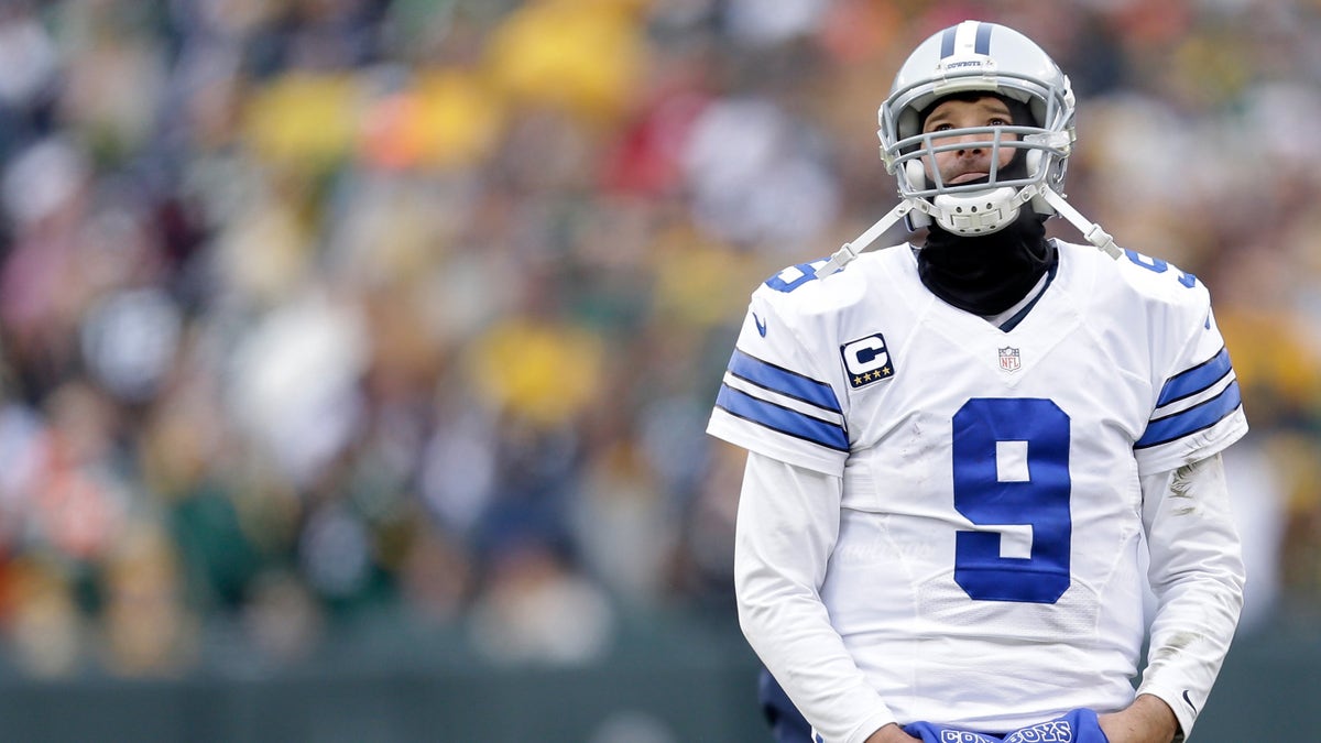 GREEN BAY, WI - JANUARY 11: Quarterback Tony Romo #9 of the Dallas Cowboys wait for the call on an instant replay during the 2015 NFC Divisional Playoff game against the Green Bay Packers at Lambeau Field on January 11, 2015 in Green Bay, Wisconsin. (Photo by Mike McGinnis/Getty Images)