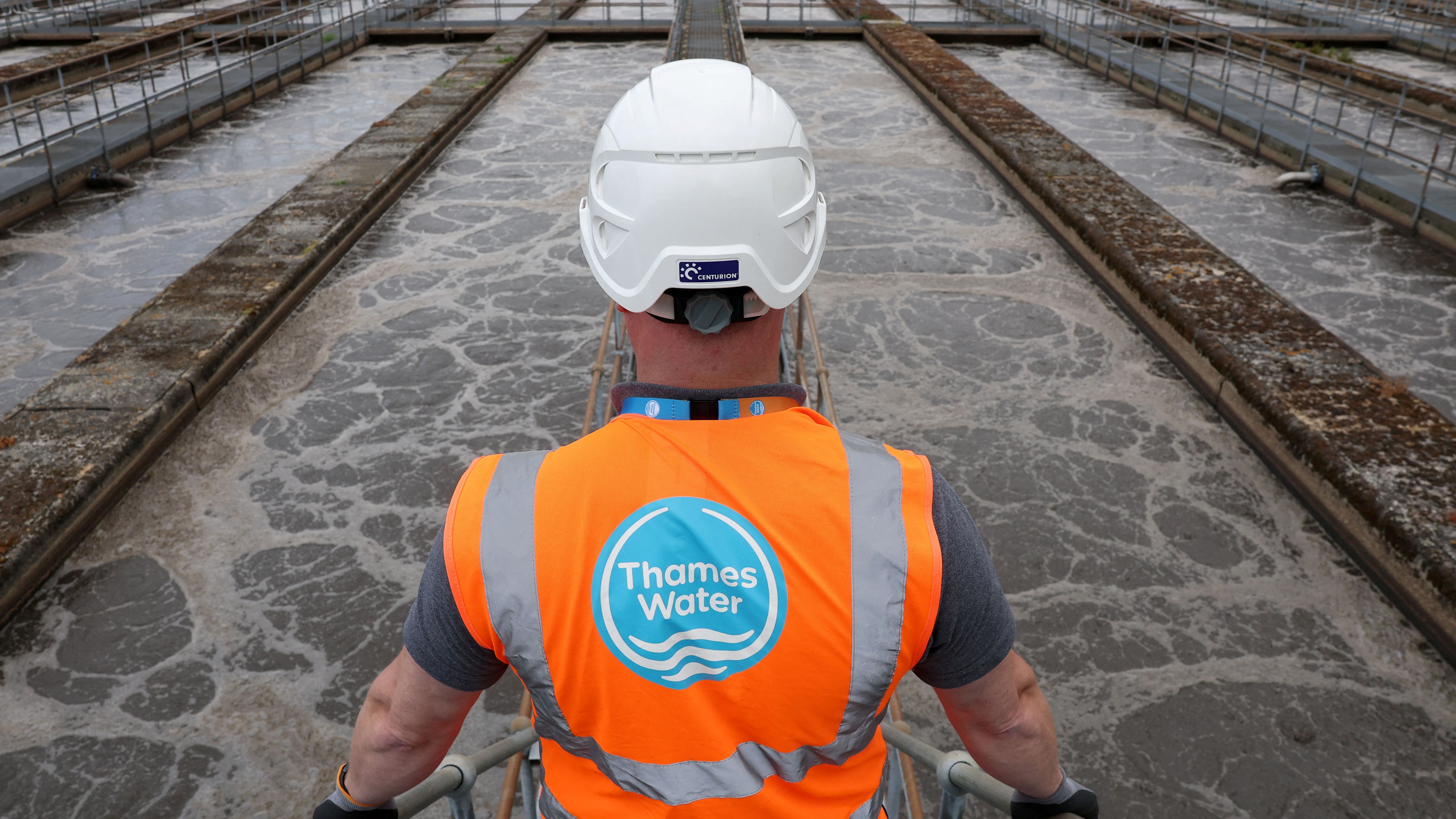 A Thames Water worker overlooking sewage processing at Mogden Sewage Treatment Works.