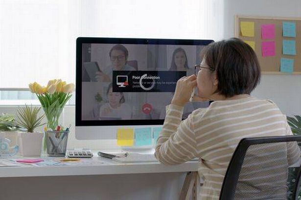 Back view mature middle-aged woman employee work from home use computer desktop pc videocall webinar conference angry annoy in low poor unreliable bad