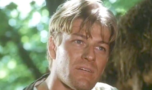 A man stands in the woods 