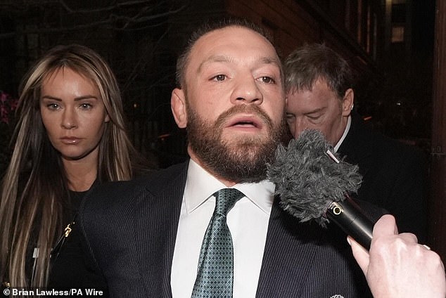 McGregor, pictured with his partner Dee Devlin in November 2024, was ordered to pay £206,000 in damages in November, plus legal costs, to Nikita Hand