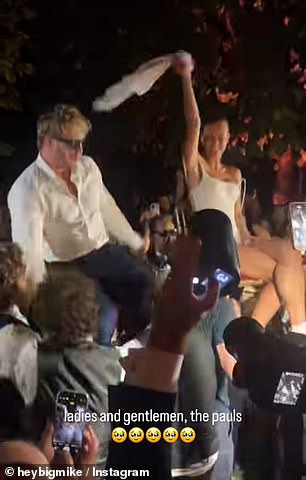 During the reception, the bride and groom were seen lifted up on chairs as guests crowded around the newlyweds