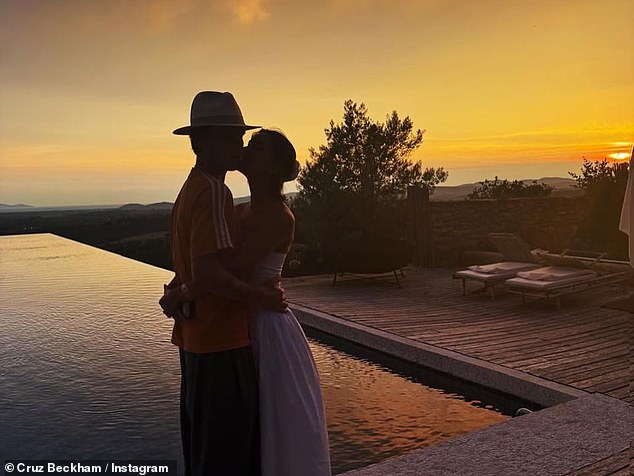 Cruz and Jackie locked lips against the stunning backdrop