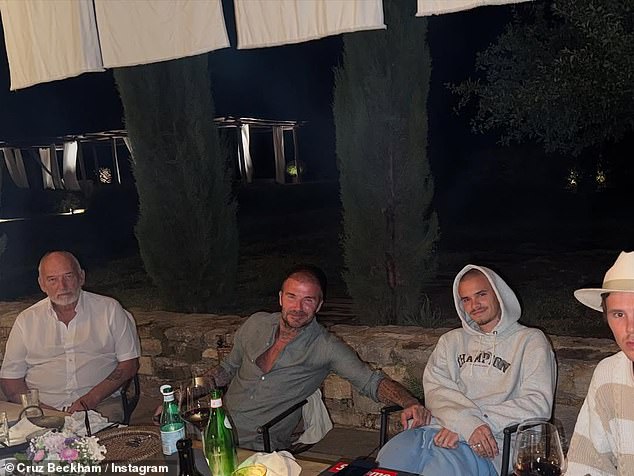 Cruz Beckham posed alongside his father David, brother Romeo and grandfather Ted