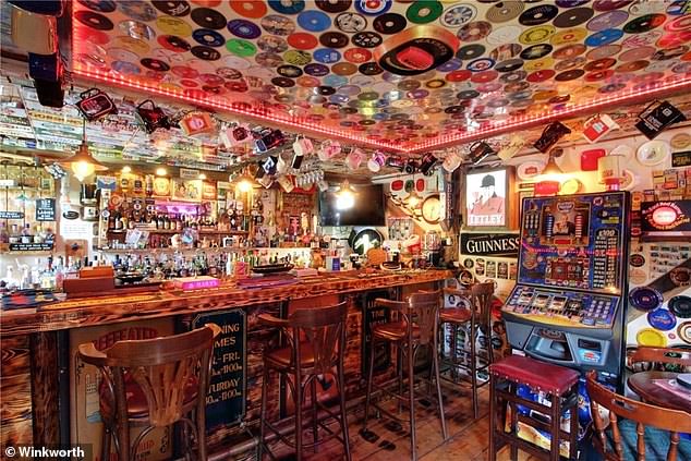 Memorabilia man: Karl Lake has spent in excess of £15,000 on pub memorabilia for his pub