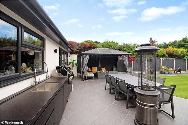 Entertaining heaven: Karl Lake's house has a outdoor kitchen, barbecue and entertaining space