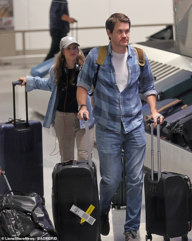 The 46-year-old Mean Girls sensation and Jamie were casually dressed in coordinating denim outfits as they retrieved their luggage from baggage claim on Wednesday evening