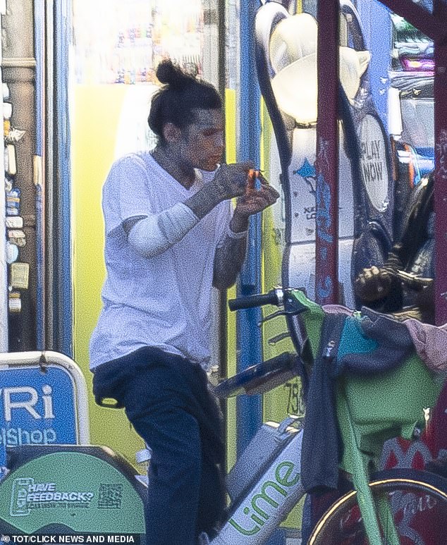 Marco Pierre White Jr is seen with a bandaged arm, appearing to buy and then smoke drugs, from two men in West London