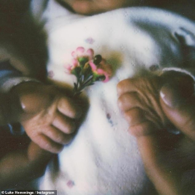 The band member, 29, took to Instagram to share an album of sweet pictures to announce their happy news