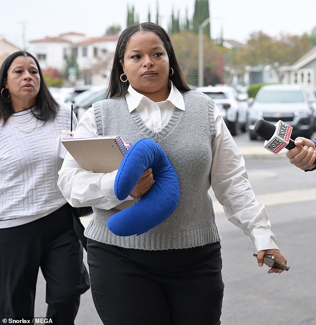Cardi is accused of assaulting, striking and spitting on Emani Ellis back in 2018 (pictured arriving in court on Tuesday)