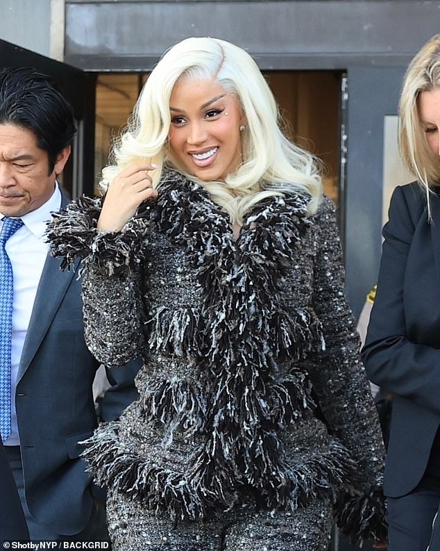 The star appeared to be in good spirits and smiled as she made her way to court