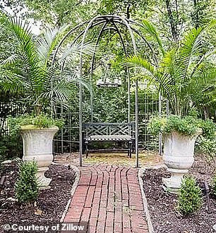 Before the lush greenery and pots of blooming flowers, the location of the couple's shoot was mostly barren