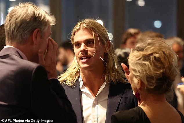Bailey Smith (pictured centre) shied away from the cameras on Thursday as he attended the 2025 AFL Awards in Melbourne