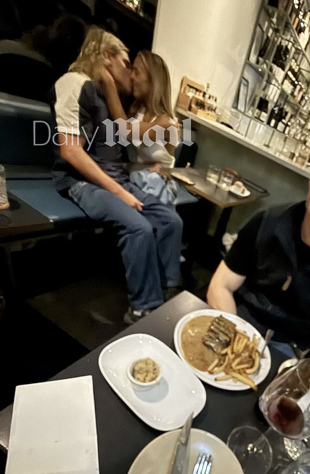 The Gold Coast influencer and AFL star were caught making out at a restaurant