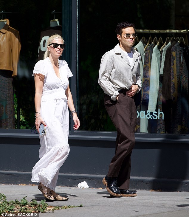 The actor, 44, looked typically dashing for his outing in a striped collared shirt and brown high-waisted trousers with chunky black boots and aviator shades