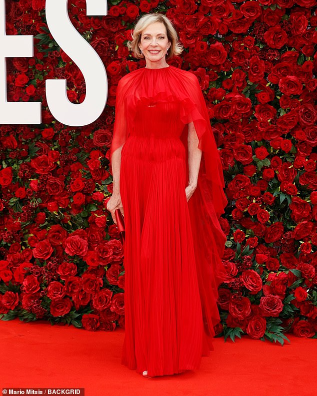 The star showcased her ageless beauty in the dress which she paired with a matching red clutch bag