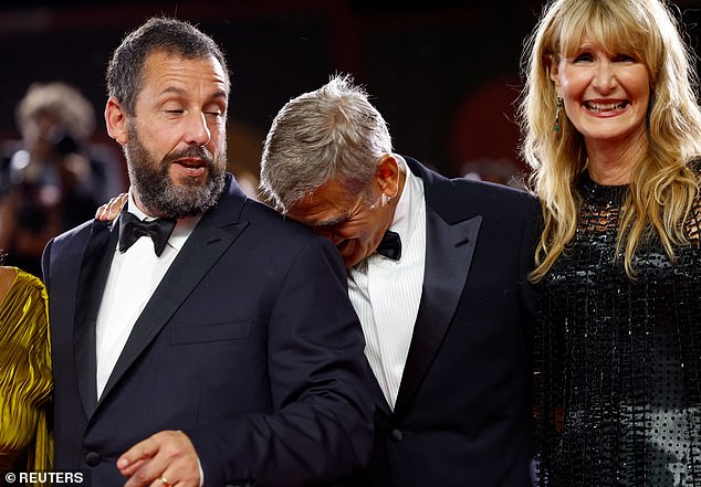 George looked to be beside himself as he laughed at a joke while resting his head on Adam's shoulder