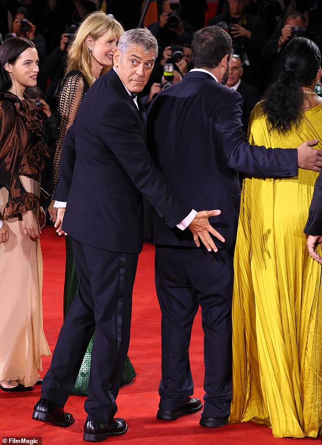 In one cheeky snap George was seen grabbing Adam's bottom as the pair joked around