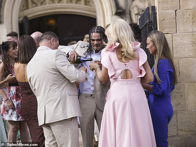 Following the ceremony guests popped open the bubbly
