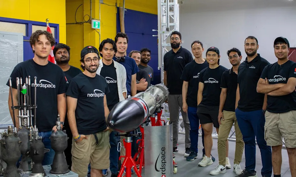 The NordSpace team of engineers stand in front of the rocket that they plan to launch from Newfoundland in the coming weeks.