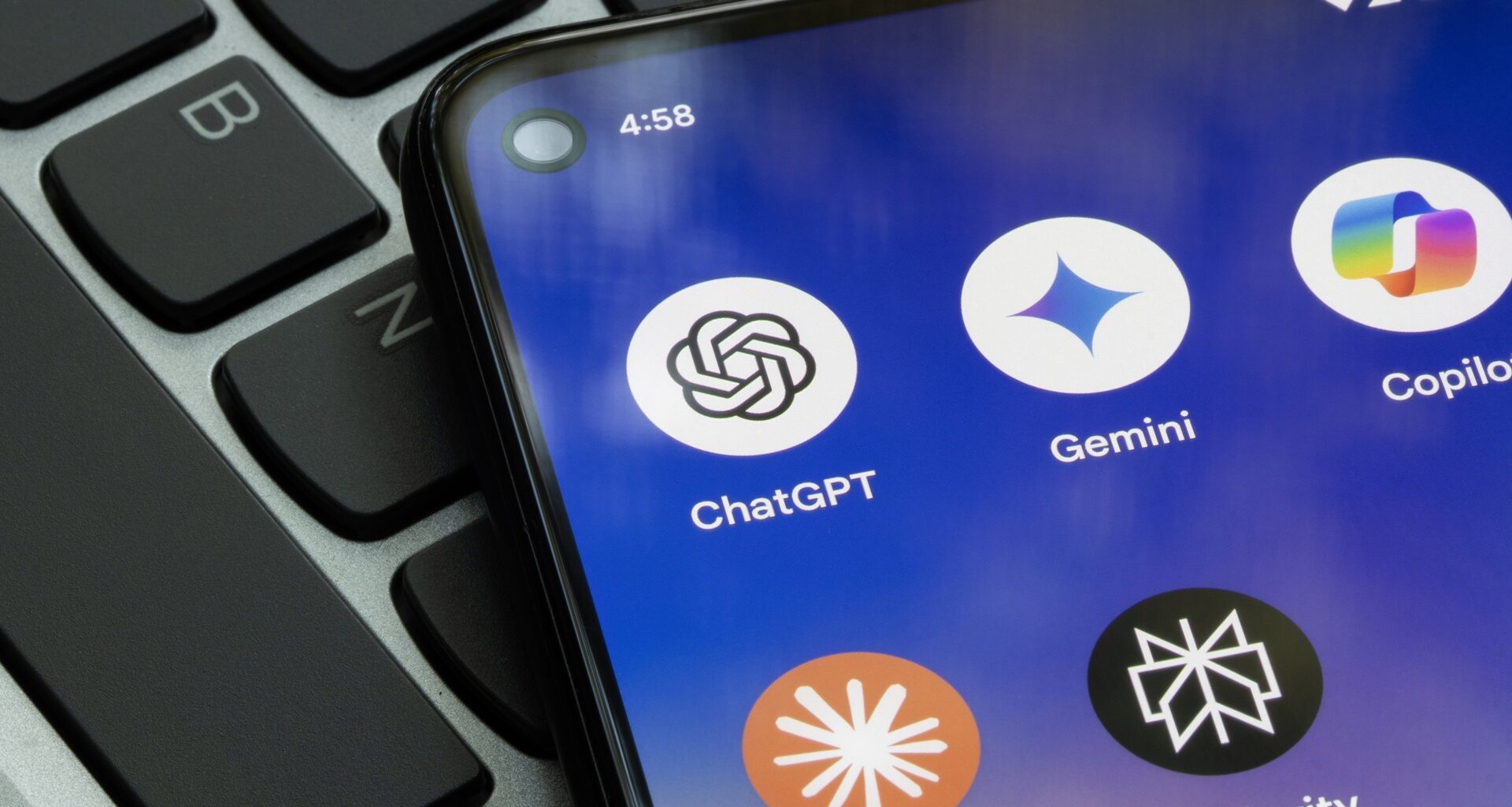 A photo of generative AI apps on a cellphone, featuring ChatGPT, Gemini, Copilot