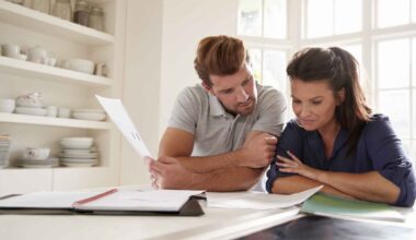 A couple looks at paperwork together.