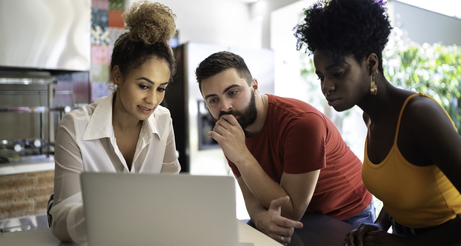 Real estate agent/financial advisor talking to a young couple stock photo