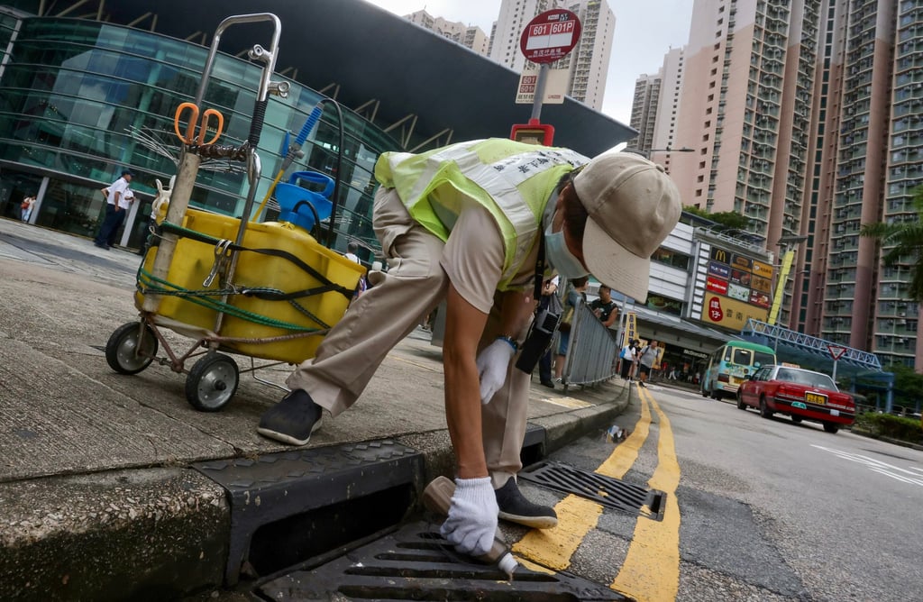 Workers perform anti-mosquito measures outside Sau Mau Ping Shopping Centre in Hong Kong on August 12, 2025, amid warnings of a heightened risk of possible chikungunya fever transmissions. Photo: Jonathan Wong
