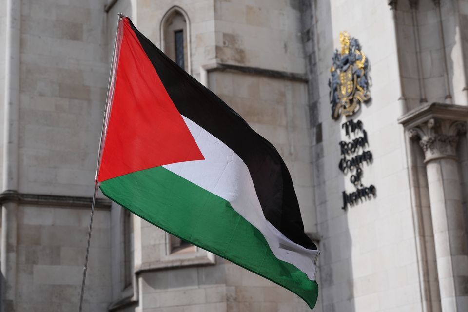 A Palestinian flag outside The Royal Courts Of Justice in central London (Jonathan Brady/PA)