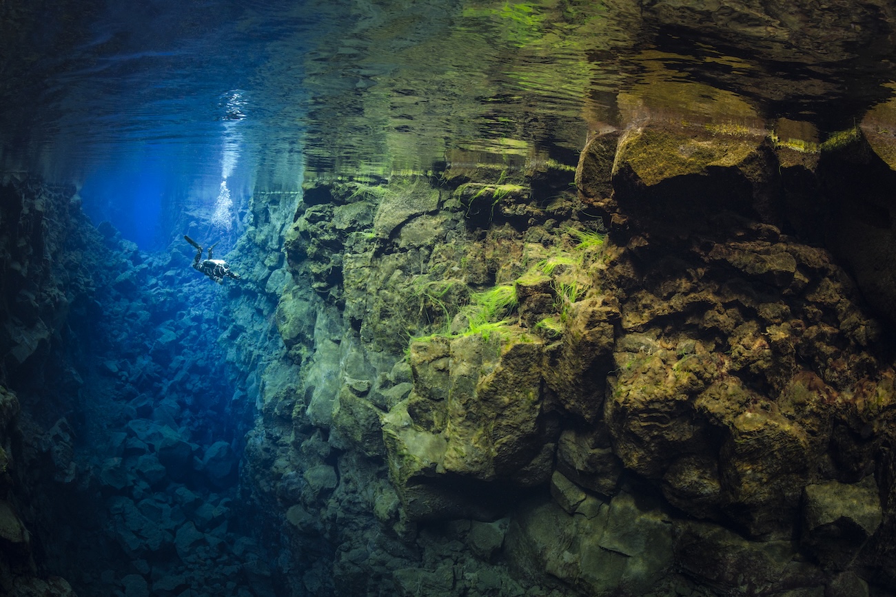 Deep divers in an underwater fissure in Iceland