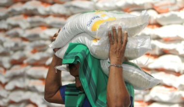 Record stockpile: A worker carries government rice aid on March 3, 2024, at the warehouse of state-owned food logistics company, Bulog, in Talumolo village, Gorontalo city, Gorontalo.