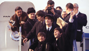 (L-R) George Harrison, Ringo Starr, John Lenon, and Paul Mccartney arriving at JFK airport in 'Beatles 64.'
