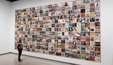 LONDON, UNITED KINGDOM - JUNE 09, 2025: A staff member looks at a selection of record sleeves from Yoshitomo Nara