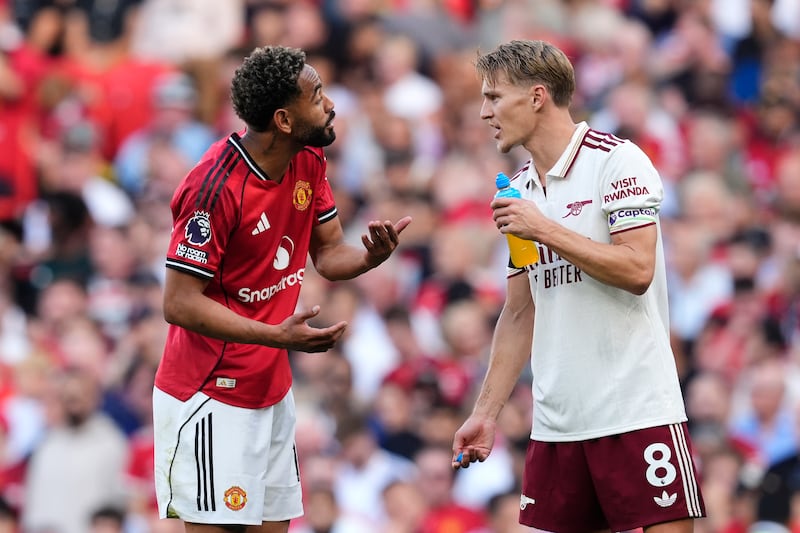 Manchester United's Matheus Cunha and Arsenal's Martin Odegaard exchange words during the game. Photograph: Nick Potts/PA