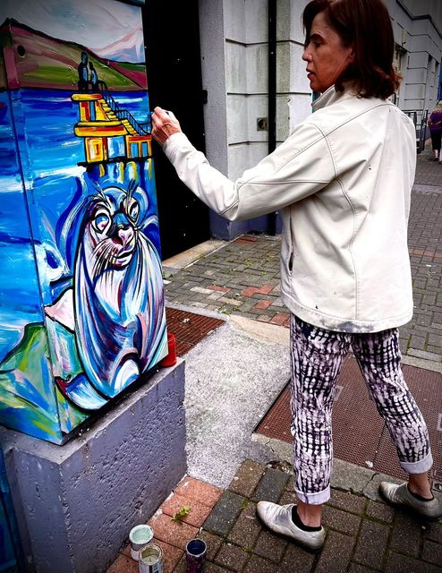 Margaret Nolan painting electricity boxes in Galway City