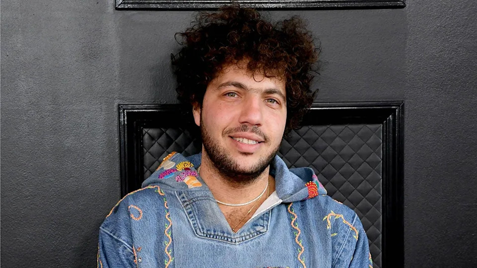 Benny Blanco walks red carpet wearing denim hoodie