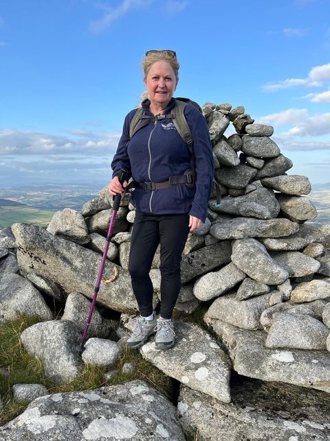 Councillor Barbara-Anne Murphy at the cairn atop Black Rock.