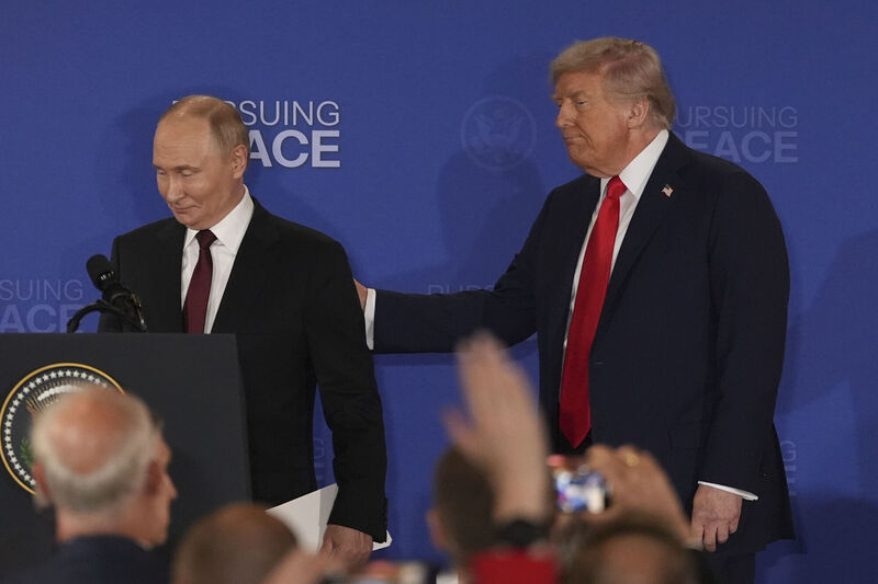 US President Donald Trump and Russian President Vladimir Putin depart at the conclusion of their joint press conference at Joint Base Elmendorf-Richardson on Friday. Picture: AP Photo/Jae C. Hong