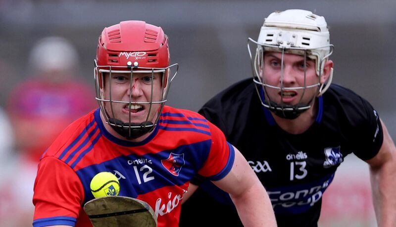  Ben Nodwell of Sarsfields with Peter O'Shea, Erins Own. Picture: Jim Coughlan.
