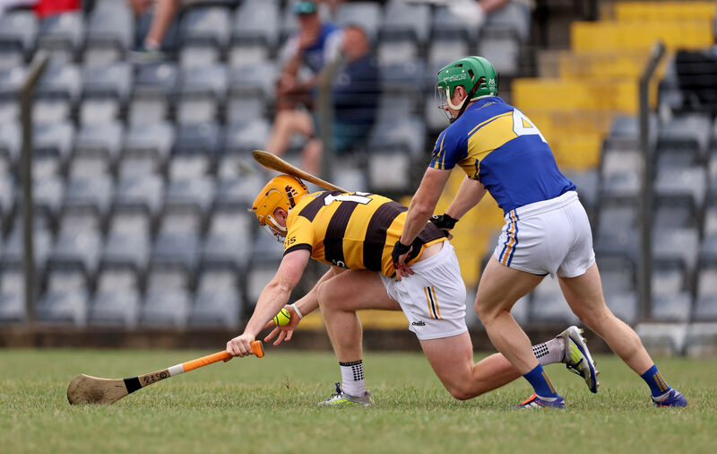  Ross O'Sullivan of Na Piarsaigh under pressure from Pat O'Sullivan of Carrigtwohill. Picture: Jim Coughlan